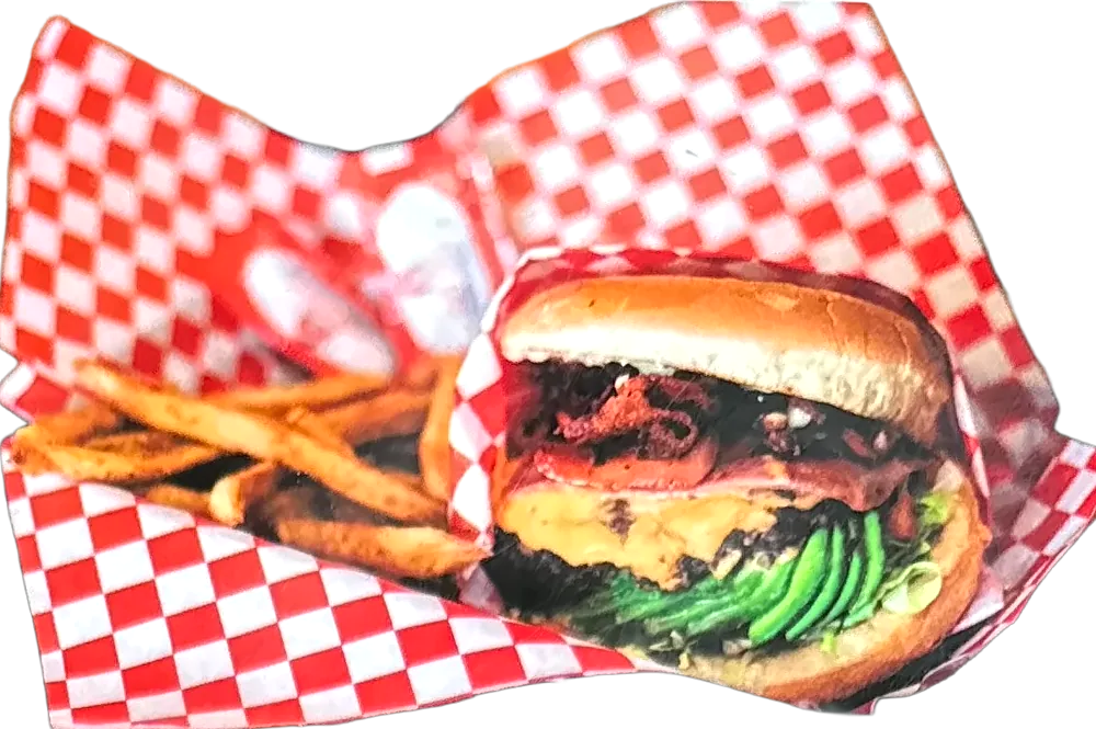 Mexican burger with avocado and fries in checkered paper