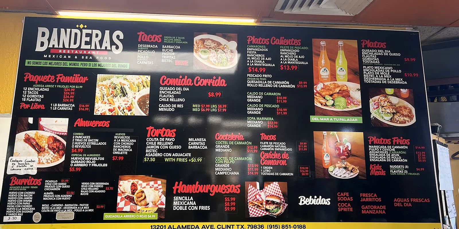 The yellow dining room of Banderas with the big black menu board on the wall